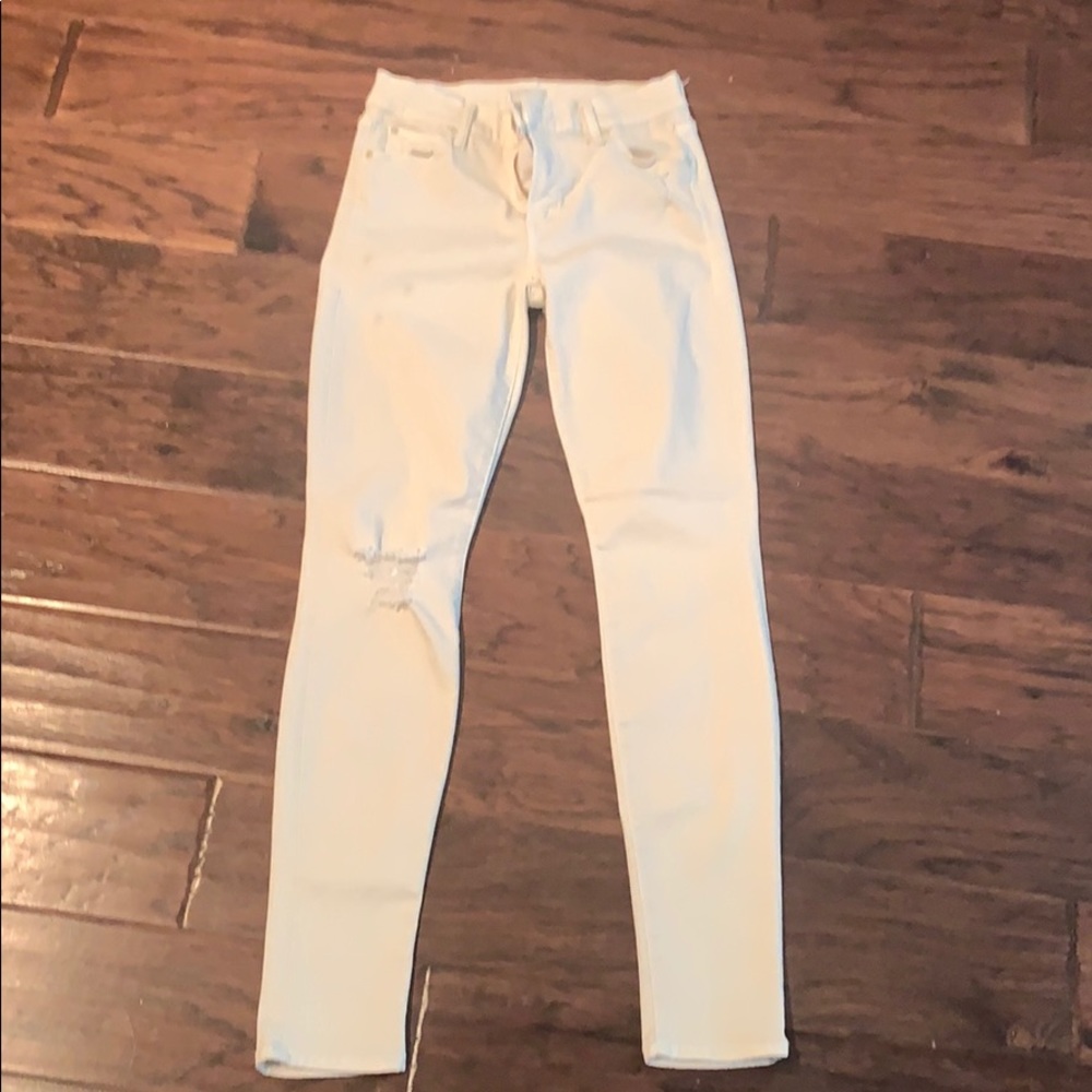 Knee-frayed ivory skinny jeans